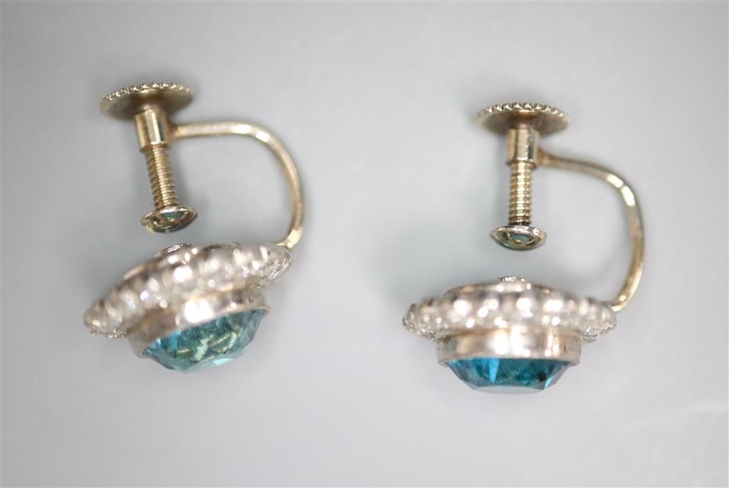 A pair of modern white metal, blue zircon and diamond cluster set circular ear clips, 11mm, gross 4.5 grams.